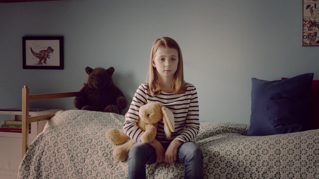 Video Reference: mammal, sitting, room, vertebrate, furniture, girl, Person