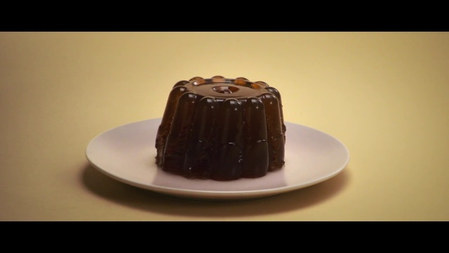 Video Reference: Food, Dessert, Chocolate, Cuisine, Dish, Ganache, Chocolate cake, Cake, Praline, Ingredient, Person, Table, Plate, Indoor, Sitting, White, Cup, Small, Piece, Single, Topped, Orange, Coffee, Birthday cake, Baked goods, Chocolate spread, Sachertorte, Chocolate syrup, Kuchen, Muffin, Snack cake, Chocolate truffle, Delicious, Snack, Flourless chocolate cake, Glaze, Chocolate pudding, Cocoa solids, Torte