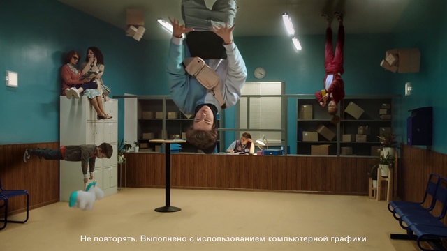 Video Reference: Room, Event, Performance, Indoor, Man, Table, Woman, Standing, Holding, Large, Player, Ball, Court, Mirror, Swinging, Bedroom, Blue, Playing, Young, Air, Jumping, Video, Doing, People, Wii, White, Wall, Person, Ceiling, Clothing, Furniture