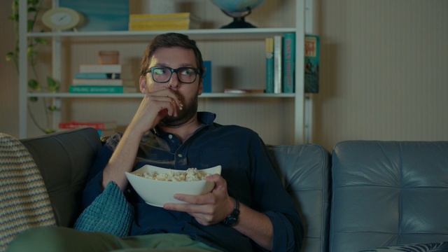 Video Reference: blue, glasses, vision care, sitting, fun, girl, eyewear, furniture, smile, product, Person