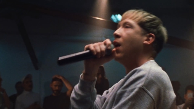 Video Reference: performance, singer, singing, music, music artist, musician, song, event, microphone, public speaking, Person