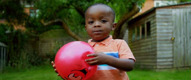 Video Reference: red, child, pink, grass, fun, boy, play, male, emotion, smile, Person
