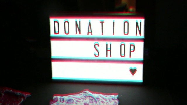 Video Reference: red, text, neon sign, display device, electronic signage, light, signage, neon, technology, lighting, Person