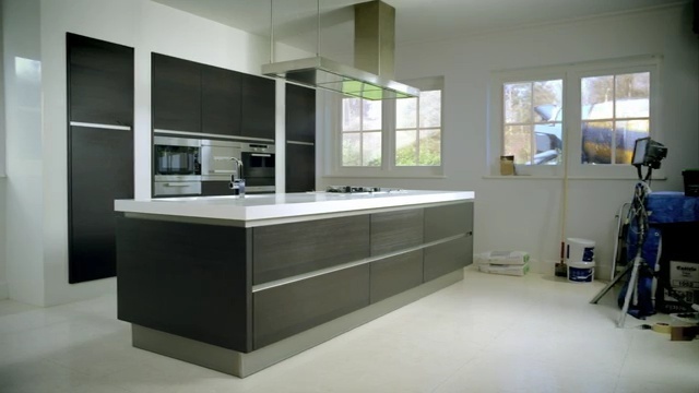 Video Reference: countertop, kitchen, room, interior design, cabinetry, sink, angle, Person