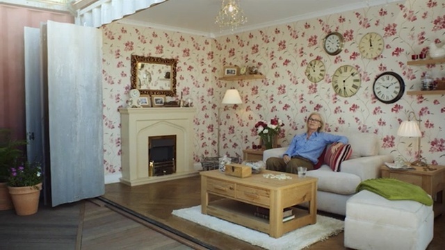 Video Reference: living room, wall, room, interior design, property, home, ceiling, wallpaper, real estate, window, Person