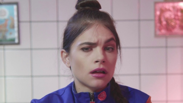 Video Reference: Hair, Face, Forehead, Eyebrow, Hairstyle, Head, Chin, Nose, Cheek, Lip, Person, Indoor, Woman, Young, Camera, Front, Man, Shirt, Standing, Wearing, Looking, Blue, Mirror, Holding, Teeth, Kitchen, Posing, Food, Boy, Mouth, Tiled, Brushing, White, Pink, Purple, Red, Room, Sink, Wall, Human face, Lipstick, Fashion accessory, Makeover