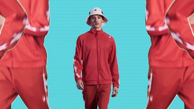 Video Reference: Clothing, Red, Sleeve, Pajamas, Outerwear, Sportswear, Standing, Workwear, Uniform, Suit