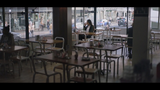 Video Reference: furniture, restaurant, table, chair, café, coffeehouse, Person
