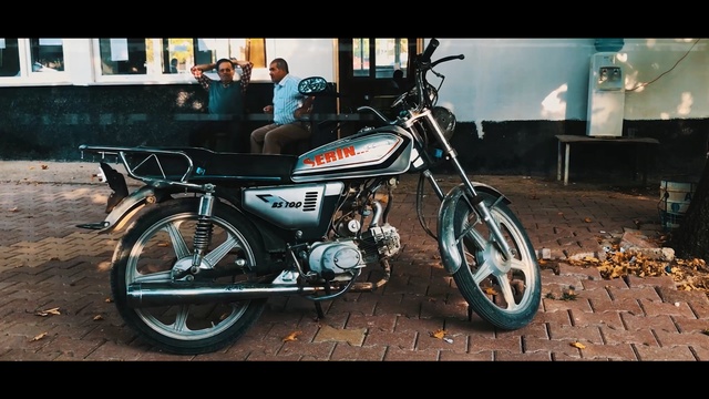 Video Reference: Land vehicle, Vehicle, Motor vehicle, Motorcycle, Moped, Car, Mode of transport, Snapshot, Spoke, Rim, Person