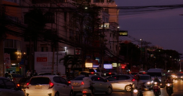 Video Reference: car, metropolitan area, city, urban area, night, metropolis, town, street, landmark, downtown, Person