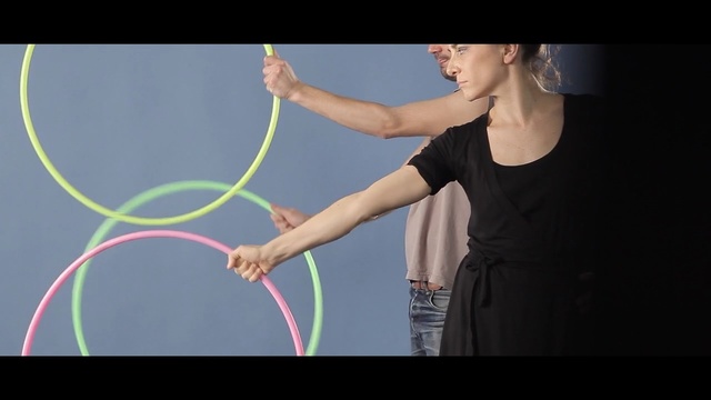Video Reference: Hula hoop, Performing arts, Rhythmic gymnastics, Arm, Toy, Hoop (rhythmic gymnastics), Performance, Gymnastics
