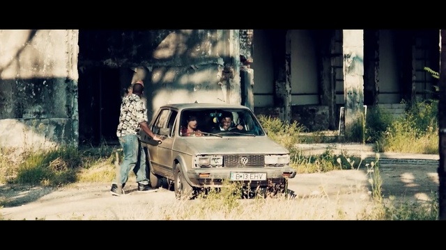 Video Reference: car, land vehicle, vehicle, motor vehicle, family car, photography, automotive design, tree, city car, screenshot, Person