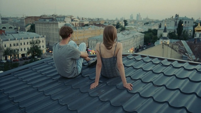 Video Reference: photograph, roof, sky, photography, wall, girl, fun, outdoor structure, water, vacation, Person