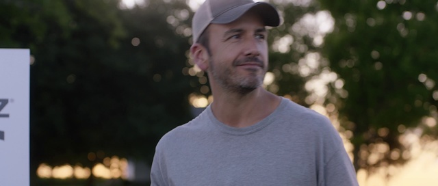 Video Reference: Facial hair, Headgear, T-shirt, Cap, Neck, Tree, Beard, Smile, Photography, Recreation