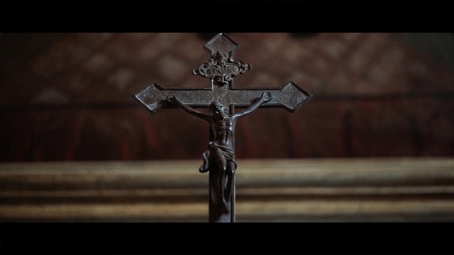 Video Reference: religious item, cross, crucifix, darkness, symbol, artifact, still life photography, screenshot