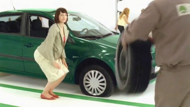 Video Reference: Land vehicle, Vehicle, Car, Vehicle door, Motor vehicle, Alloy wheel, City car, Auto show, Compact car, Person
