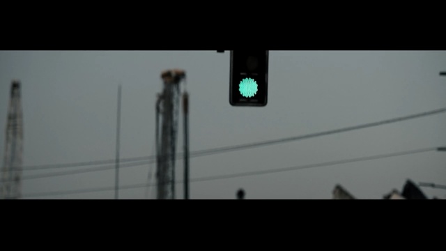 Video Reference: Black, Lighting, Light fixture, Street light, Traffic light, Electricity, Sky, Line, Darkness, Photography, Person