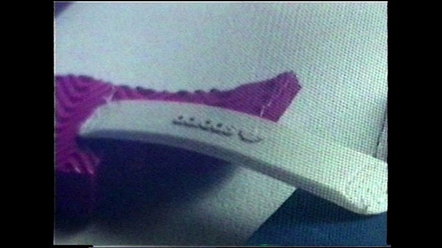 Video Reference: Violet, Purple, Text, Pink, Footwear, Material property, Font, Magenta, Shoe