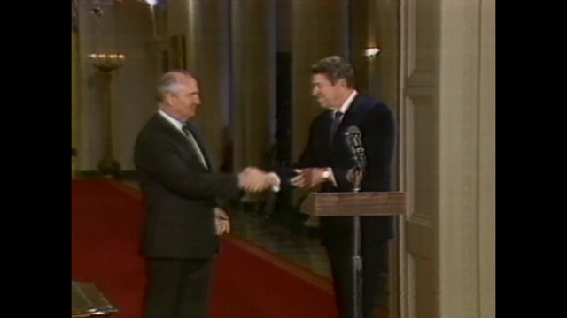 Video Reference: Public speaking, Speech, Suit, Event, Formal wear, Official, Orator, Ceremony, Conversation, Furniture, Person