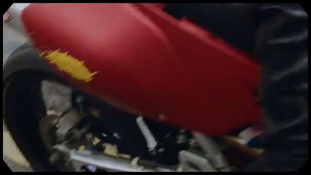 Video Reference: Motorcycle, Red, Vehicle, Automotive lighting, Automotive exterior, Auto part, Exhaust system, Automotive exhaust, Automotive wheel system, Engine