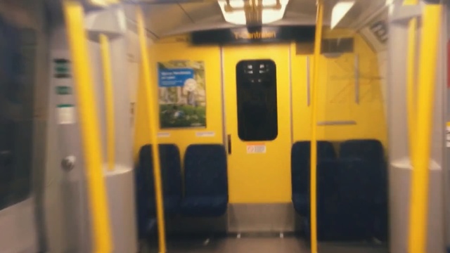 Video Reference: transport, yellow, public transport, rapid transit, mode of transport, passenger, train, vehicle, rolling stock, railroad car, Person