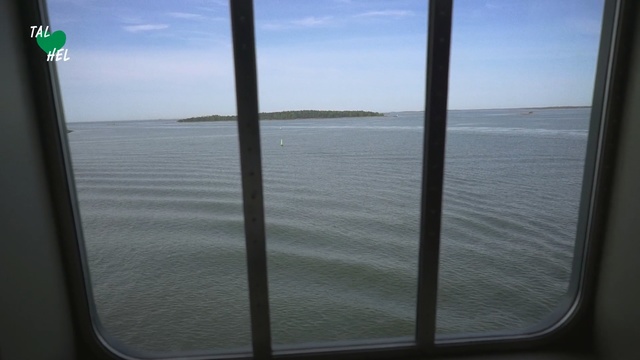 Video Reference: Sky, Water, Window, Sea, Glass, Ocean, Person, Outdoor, View, Pole, Sitting, Clouds, Seen, Large, Overlooking, Beach, Body, Green, Umbrella, Boat, Table, Bed, Mirror, Standing, Blue, Sign, Airplane, White, Lake, Cloud, Shore