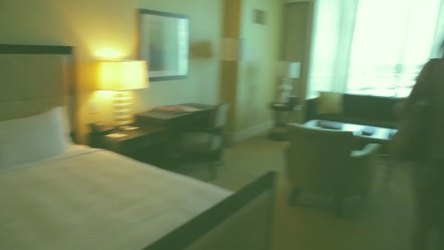 Video Reference: room, property, floor, suite, interior design, real estate, home, table, apartment, house, Person