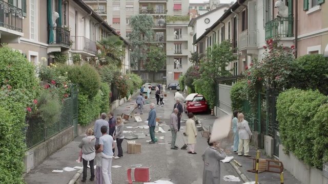 Video Reference: neighbourhood, town, residential area, street, city, tree, pedestrian, mixed use, recreation, sidewalk, Person