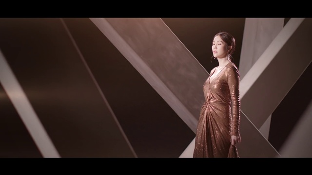 Video Reference: Lady, Beauty, Fashion, Dress, Photography, Fashion design, Formal wear, Gown, Flash photography, Model, Person, Clothing, Standing, Looking, Woman, Front, Holding, Suit, Mirror, Posing, Umbrella, Wearing, Young, Black, Man, White, Room, Screenshot, Human face