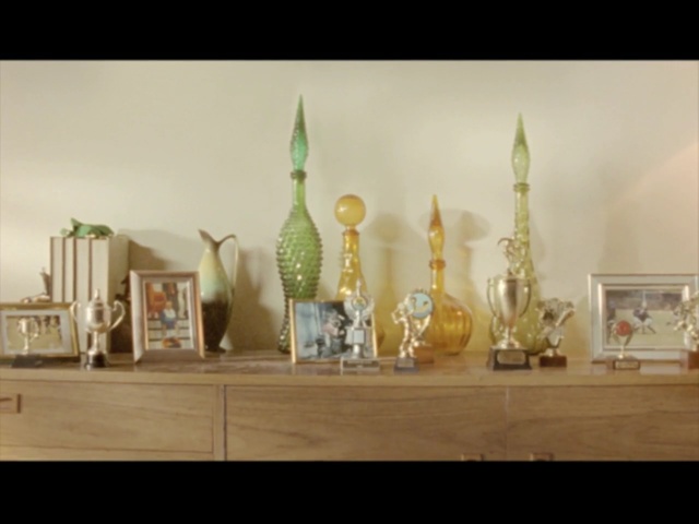 Video Reference: interior design, table, furniture, decor, still life photography, Person