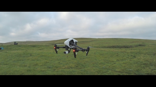 Video Reference: grassland, ecosystem, pasture, sky, air sports, highland, steppe, hill, mode of transport, grass