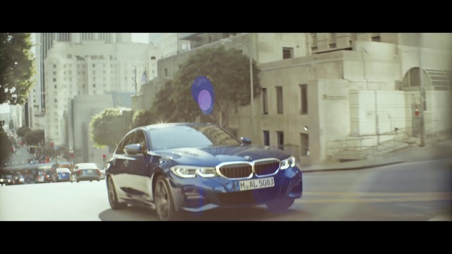 Video Reference: Land vehicle, Vehicle, Car, Automotive design, Bmw, Luxury vehicle, Performance car, Executive car, Snapshot, Small, Photo, Building, Sitting, Light, Table, White, Street, Mirror, Driving, Riding, Red, Man, City, Traffic, Room, Wheel, Text, Personal luxury car, Auto part, Tire, Mid-size car, Full-size car, Sports sedan