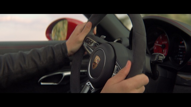 Video Reference: Vehicle, Steering part, Steering wheel, Car, Automotive design, Driving, Luxury vehicle, Wheel, Supercar, Personal luxury car, Person, Holding, Man, Photo, Hand, Using, Woman, Young, Video, White, Mirror, Auto part, Land vehicle, Center console, Head restraint, Car seat, Car seat cover, Seat belt, Control panel