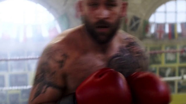 Video Reference: Barechested, Chest, Boxing, Facial hair, Professional boxing, Muscle, Arm, Boxing glove, Mouth, Boxing equipment