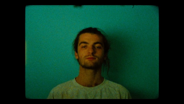 Video Reference: Face, Facial hair, Green, Hair, Photograph, Blue, Beard, Facial expression, Chin, Cheek, Person