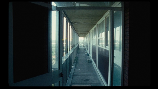 Video Reference: Architecture, Daylighting, Line, Building, Glass, Symmetry, Window, Photography, Darkness, Facade, Sitting, Door, Platform, Front, Monitor, Bus, Sidewalk, Side, Large, View, White, Screen, Room, Street, Table, Train, Station, Television, City, Bench, Brick, Red, Subway, Standing, Man, Night, Sky, Water