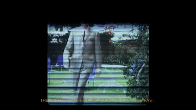 Video Reference: blue, green, black, text, structure, darkness, light, architecture, atmosphere, display device, Person