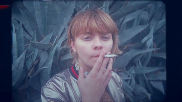 Video Reference: face, person, nose, human hair color, girl, lady, head, cheek, hairstyle, snapshot