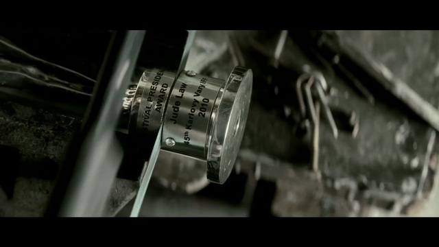 Video Reference: darkness, metal, black and white, firearm, auto part, weapon, font, screenshot, machine, monochrome