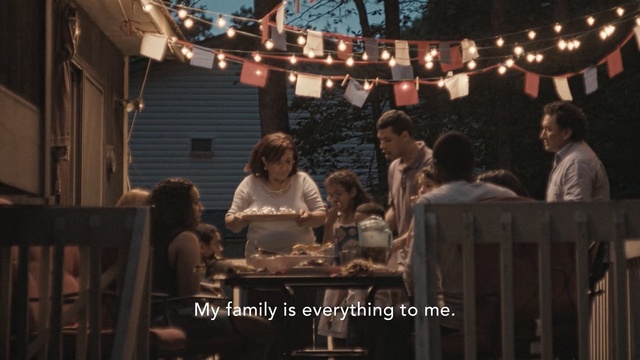 Video Reference: family, dinner, family, house, celebration, birthday, people, happy, food, table, outside, Person