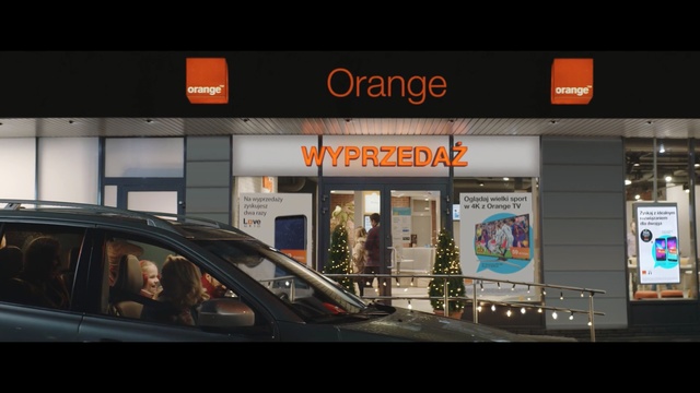 Video Reference: Building, Vehicle, Car, Advertising, Font, Signage, Retail, Display advertising, City, City car, Person