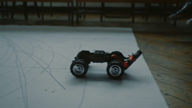 Video Reference: Radio-controlled car, Vehicle, Motor vehicle, Automotive tire, Radio-controlled toy, Toy vehicle, Truggy, Car, Tire, Automotive design, Person