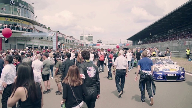 Video Reference: People, Crowd, Vehicle, Luxury vehicle, Car, Event, Tourism, Pedestrian, Sport venue, Photography
