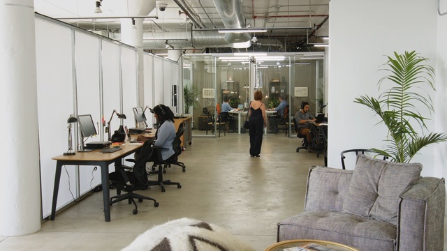 Video Reference: Interior design, Room, Building, Office, Ceiling, Furniture, Design, Loft, Table, Floor, Indoor, Living, Dog, Chair, Filled, Large, Area, Black, Sitting, Kitchen, White, Standing, People, Man, Wall, Desk, Computer, Person, Office building, Clothing, Whiteboard, Several