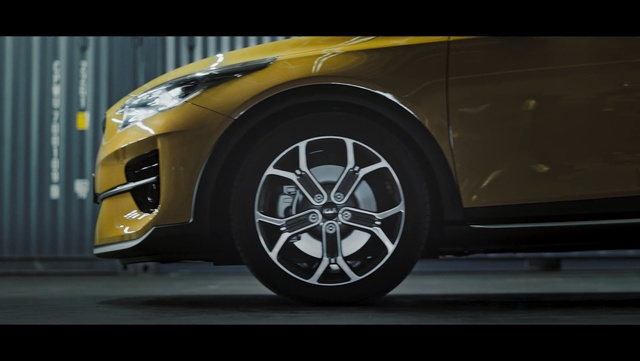 Video Reference: Land vehicle, Vehicle, Car, Alloy wheel, Wheel, Automotive design, Rim, Automotive tire, Automotive wheel system, Tire, Road, Yellow, Sitting, Black, Street, Riding, Man, White, Cat, Red, City, Parked, Automotive, Auto part, Supercar, Luxury