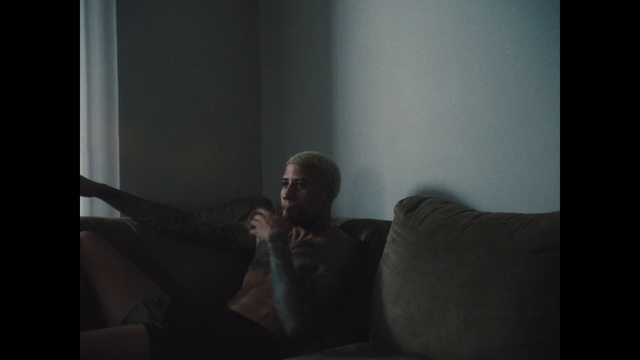 Video Reference: Black, Light, Darkness, Room, Human, Sitting, Photography, Facial hair, Portrait, Furniture