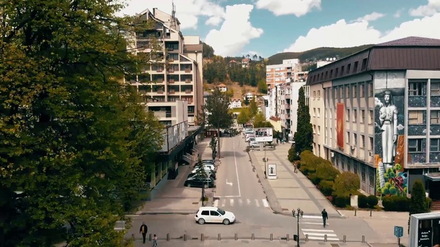 Video Reference: Residential area, Neighbourhood, Town, Metropolitan area, City, Urban area, Building, Human settlement, Street, Mixed-use