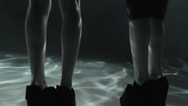 Video Reference: black, footwear, leg, joint, foot, human body, darkness, shoe, human leg, girl, Person