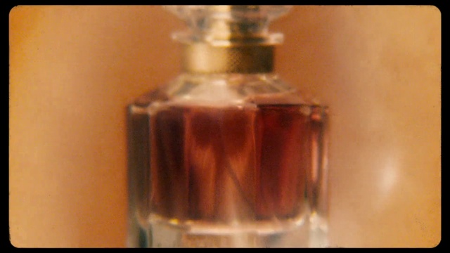Video Reference: Glass bottle, Perfume, Bottle, Product, Caramel color, Liquid, Fluid, Alcohol, Drink
