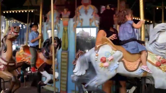 Video Reference: Carousel, Amusement ride, Amusement park, Park, Fun, Recreation, Nonbuilding structure, Event, Person